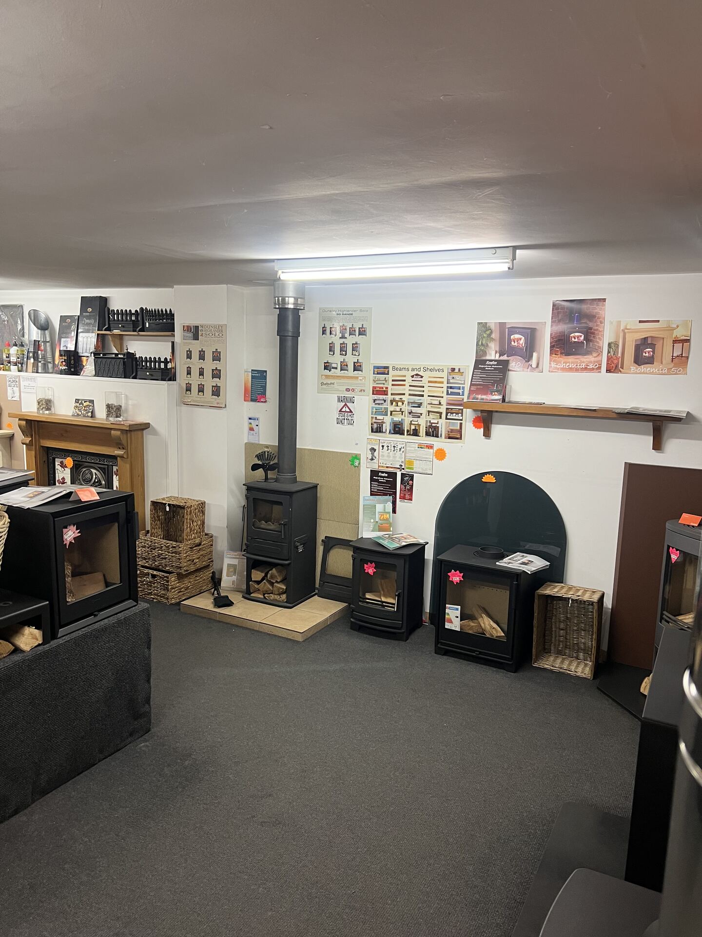 Wide view of the showroom floor with multiple stoves